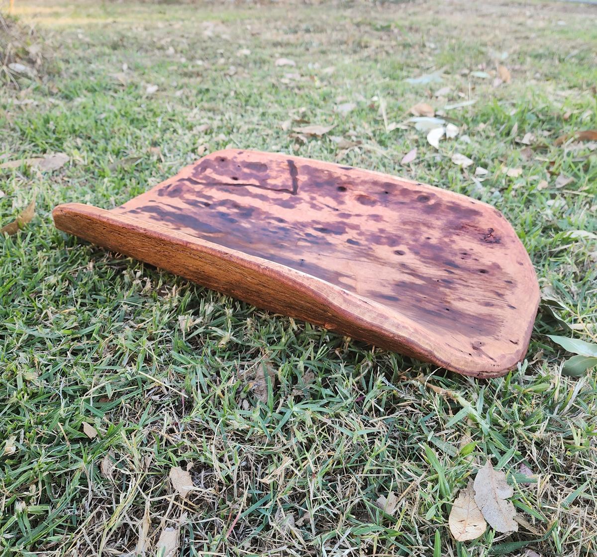 Handcrafted wooden artwork photographed outdoors for Karinya Ngukuthati Art Gallery