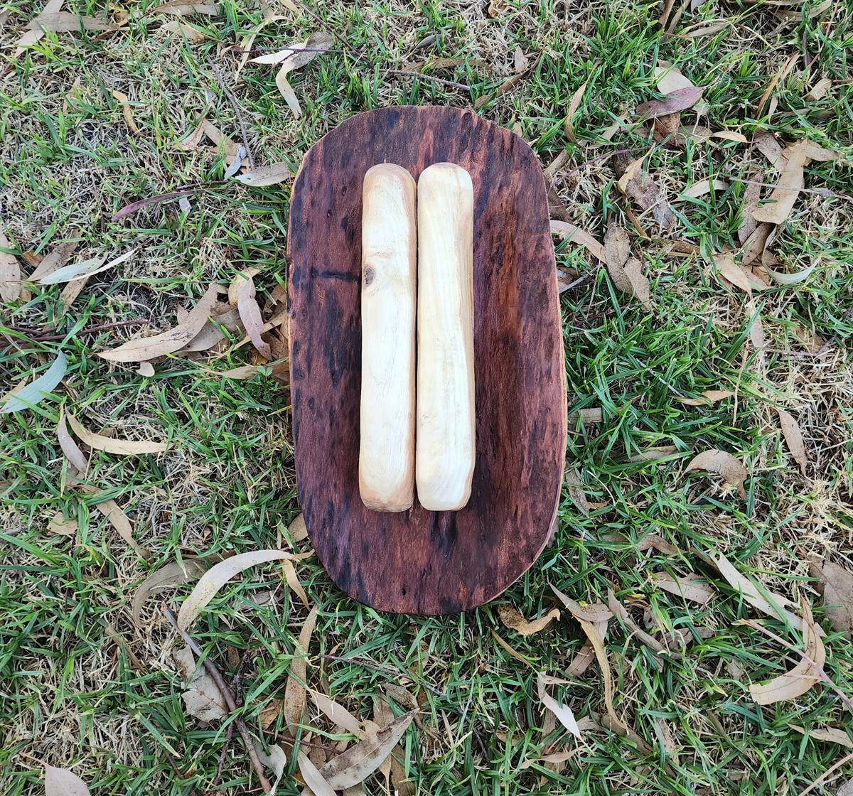 Close detail of handcrafted wooden artwork photographed outdoors for Karinya Ngukuthati Art Gallery